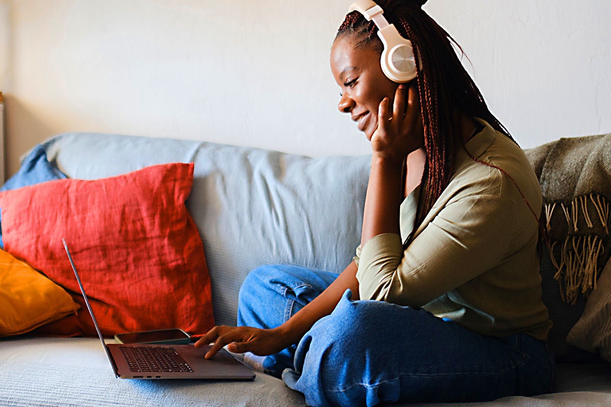 Girl Streaming Videos on her Laptop