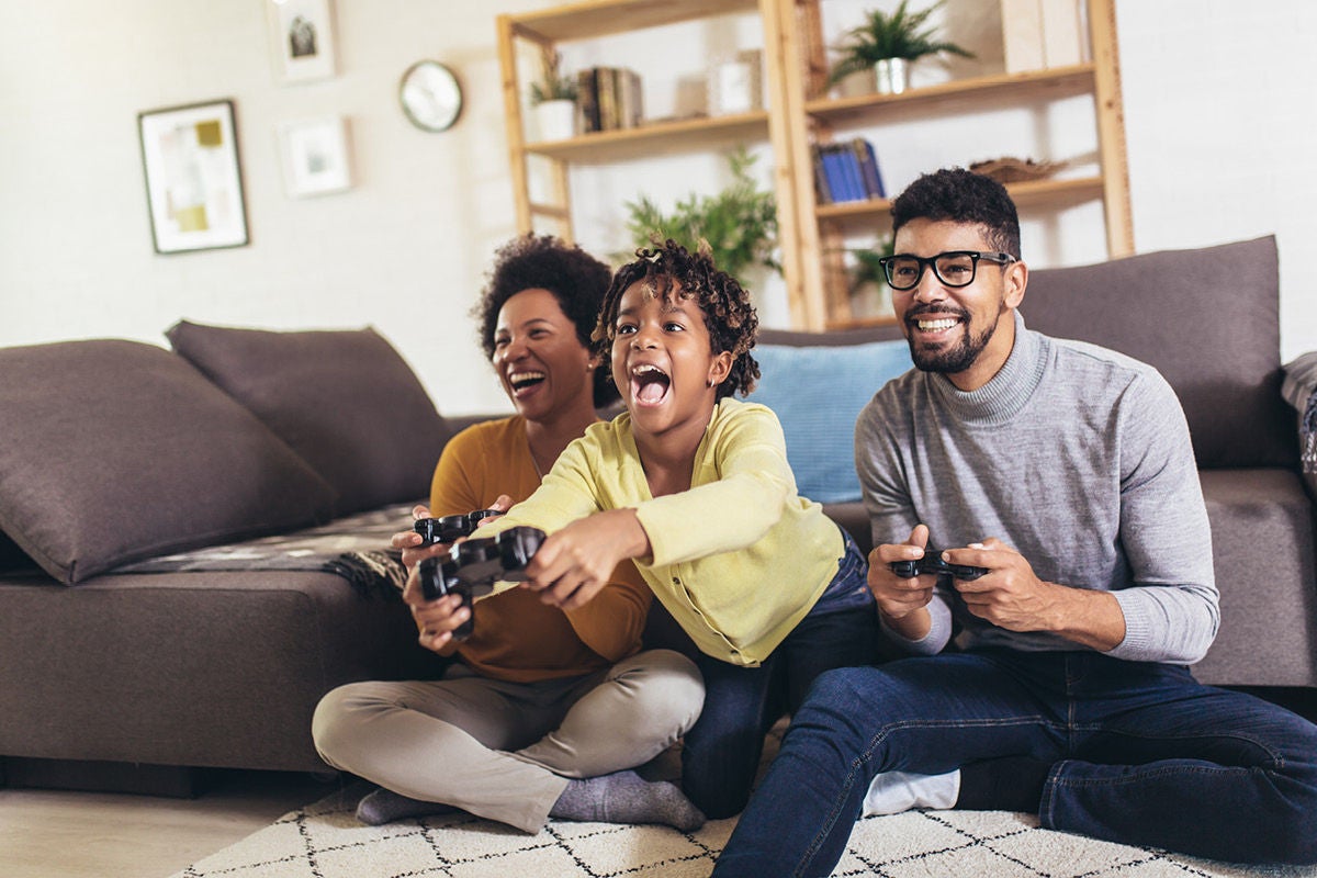 Family enjoying online gaming at home with high-speed internet and reliable Wi-Fi connection with Optimum.