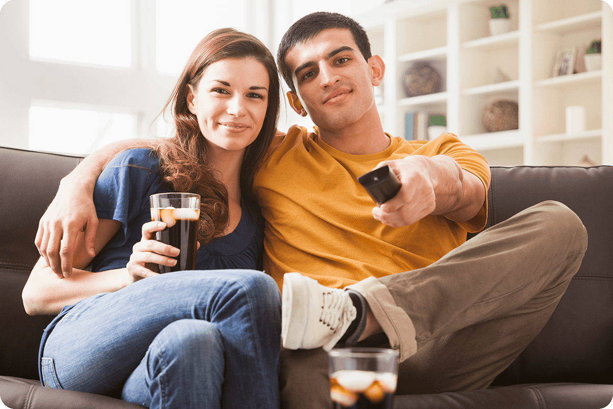 Man & Woman watching TV on Samsung The Frame TV