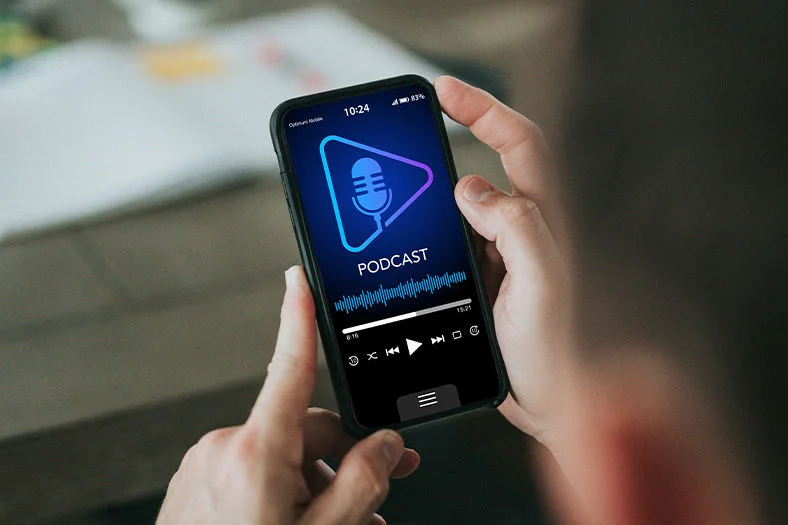 Someone in Mobile Phone looking the Best Podcast App