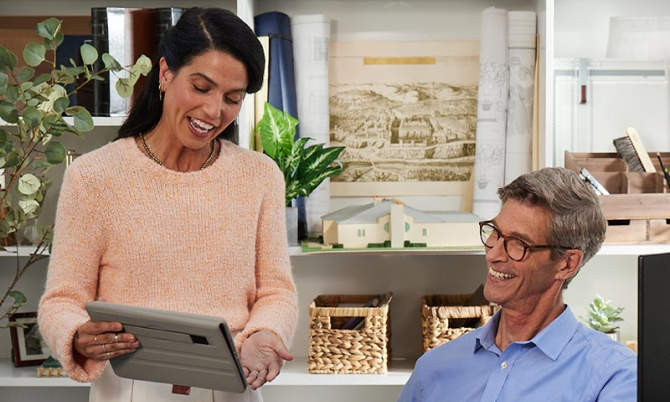 Couple using tablet outside