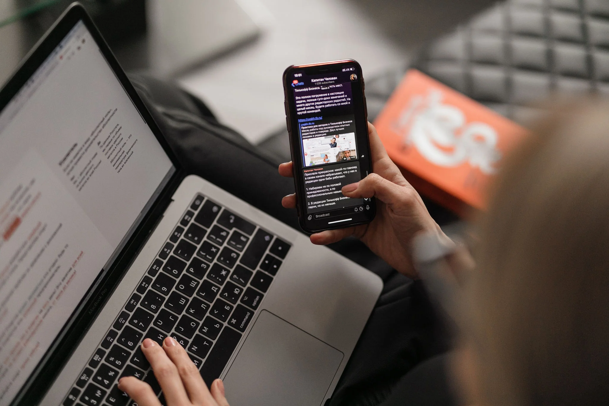 Person using laptop and phone