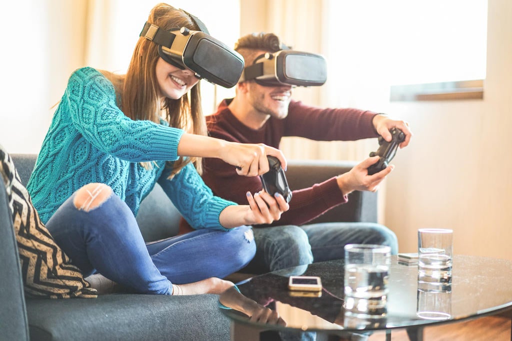 Man and woman playing videogames