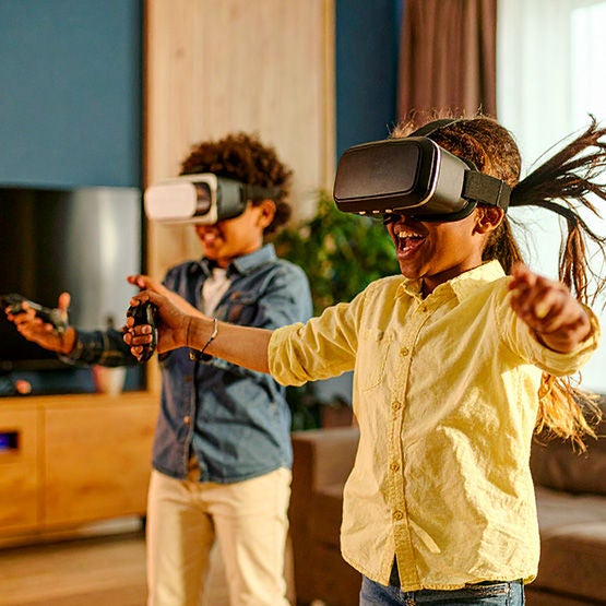 Ywo people playing a virtual reality game using Optimum Fiber Internet